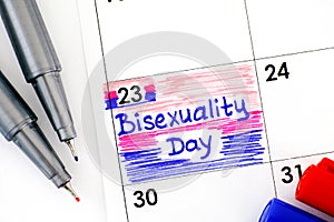Reminder Bisexuality Day in calendar with red and blue pens