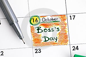 Reminder Boss Day in calendar with green pen.