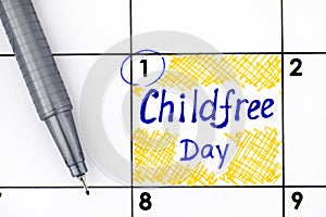 Reminder Childfree Day in calendar with pen photo