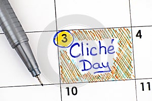 Reminder Cliche Day in calendar with pen