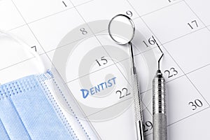 Reminder dentist appointment in calendar and professional dental tools