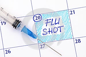 Reminder Flu Shot in calendar with syringe
