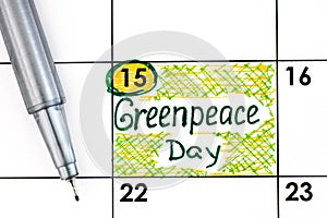 Reminder Greenpeace Day in calendar with pen