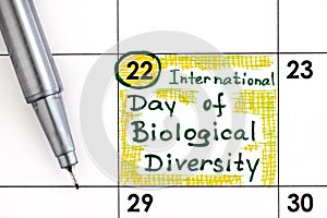 Reminder International Day of Biological Diversity in calendar with pen
