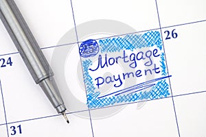 Reminder Mortgage Payment in calendar with pen