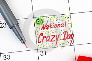 Reminder National Crazy Day in calendar with red pen