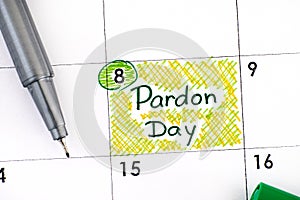 Reminder Pardon Day in calendar with pen