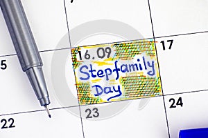 Reminder Stepfamily Day in calendar with blue pen. photo