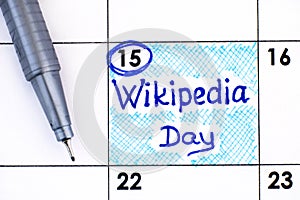 Reminder Wikipedia Day in calendar with pen photo