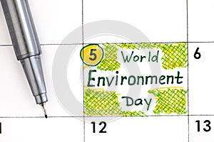Reminder World Environment Day in calendar with pen