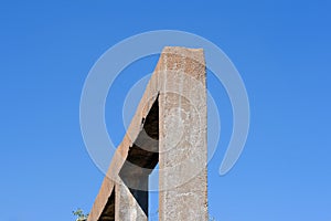 REMNANT CONCRETE FRAME STRUCTURE IN THE RUINS OFAN OLD SALT EXTRACTION PLANT AGAINST CLEAR BLUE SKY