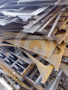 Remnant of metal,steels wait for sell to recycle,Trimming thin and straight metal. Metallurgical products metal