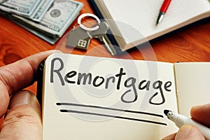 Remortgage handwritten word by man