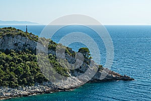 Remote cap with pine trees and signalling device in Adriatic sea