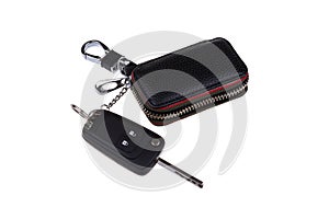 Remote car key and leather case isolated on white background
