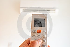 remote control command for air conditioning to be handled point to the device with the order to 23°C