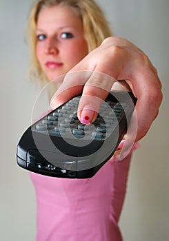 Remote Control in girl's hand photo