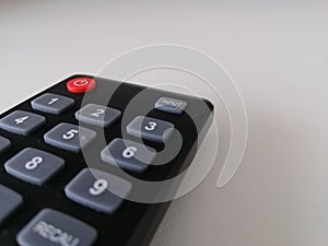 Remote control input button to change television source