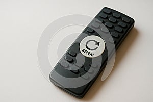 Remote control with repeat button. Space for text.