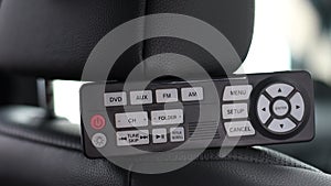 Remote control for TV, video player or music in the car interior. Entertainment system