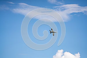 Remote controlled aircraft flying on blue sky