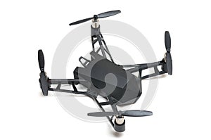 A remote controlled flying drone with four propeller rotors and spy camera on board