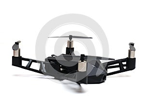 A remote controlled flying drone with four propeller rotors and spy camera on board