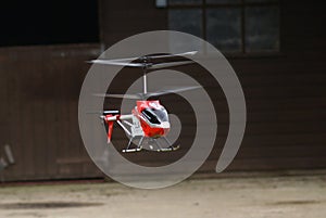 Remote controlled toy helicopter in flight