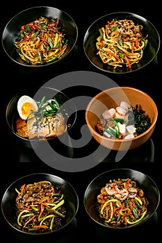 Remote delivery Asian cuisine: wok noodles with beef, miso soup, fried pork, vegetables, broth, boiled shrimp, pickled mushrooms,
