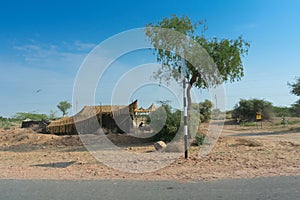 A remote desert village inside the desert. Distant horizon, Hot summer with cloudless clear blue sky.