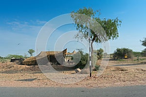 A remote desert village inside the desert. Distant horizon, Hot summer with cloudless clear blue sky. photo