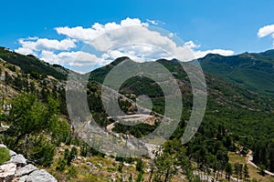 Remote desolated narrow roads, through multiple hairpin bends, leading down the mountain slopes to Pavlova Strana viewpoint