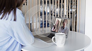 Remote employee conferencing in online group virtual chat on laptop screen. Company staff colleagues and boss using pc