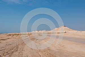 Remote empty sand filled desert in Zekreet- Qatar middle east