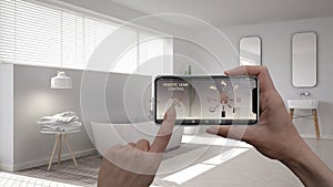 Remote home control system on a digital smart phone tablet. Device with app icons. Interior of minimalist white bathroom in the ba