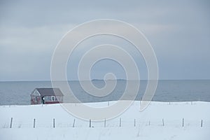 Remote house in coastal landscape Flakstad Flakstadoya Loftofen Norway