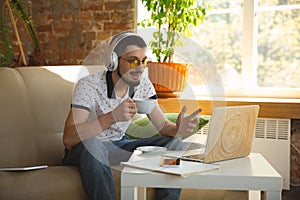 Man working from home during coronavirus or COVID-19 quarantine, remote office concept