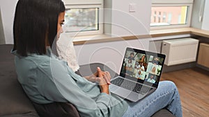 Remote meeting via video call. Asian woman using app on laptop for online communication