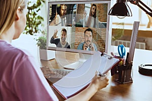 Remote meeting. Woman working from home during coronavirus or COVID-19 quarantine, remote office concept.