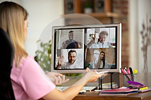 Remote meeting. Woman working from home during coronavirus or COVID-19 quarantine, remote office concept.