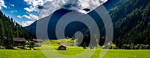 Remote Settlement And Small Chapel In Rural Landscape At Mountain Grossvenediger In Tirol In Austria