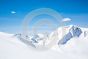 Remote summit peak in the Canadian Rocky Mountains near Roger`s Pass. Spring snow skiing backcountry in the wilderness