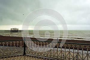 Remote view of Brighton West Pier in sea , England, UK