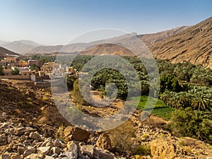A remote village with its oasis and palm dates plantation in Oman - 1