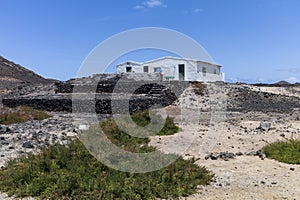 Remote whitewashed Fishermenâ€™s hut island.