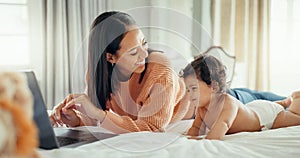 Remote work, love and mother with baby in a bed for bonding, relax and playing in their home. Work from home, freelance
