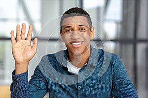 Remote work online interview video conference Video call Headshot of a positive male looking at the camera and smiling