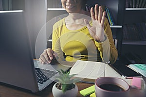 Remote working online and business meeting at Home office Concept. Businesswoman work via laptop. Asian entrepreneurs watching