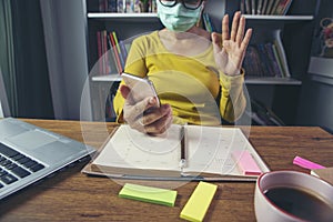 Remote working online and business meeting at Home office Concept. Businesswoman work via smartphone. Asian entrepreneurs watching