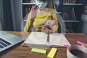 Remote working online and business meeting at Home office Concept. Businesswoman work via smartphone. Asian entrepreneurs watching